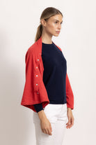 LAVINIA - Poncho con bottoni (Corallo)